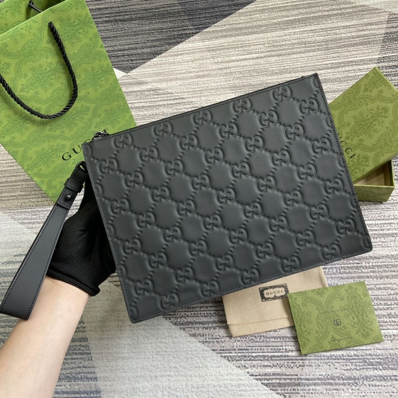 G*u*i clutch bags